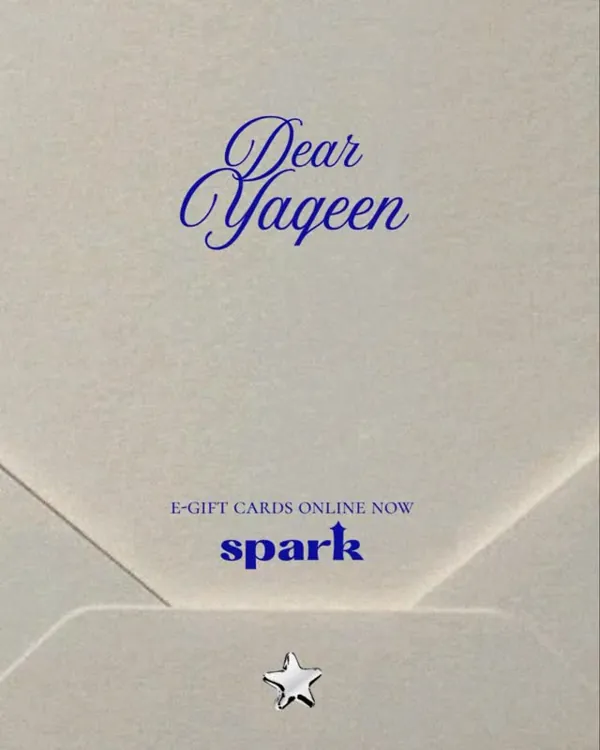 The printed Spark card in its envelope, addressed Dear Yaqeen in blue script